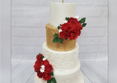 Wedding Cake - 4 tier - Gold glitter with red rose bouquets and pearl leaf decor