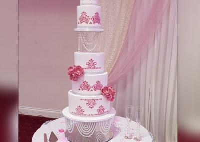 Wedding Cake - Split 5 tier cake with pink decor, pink flowers and pearl divider