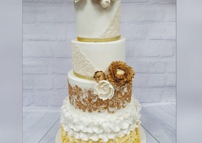 Wedding Cake - 4 tier with gold and white flowers and decorated base