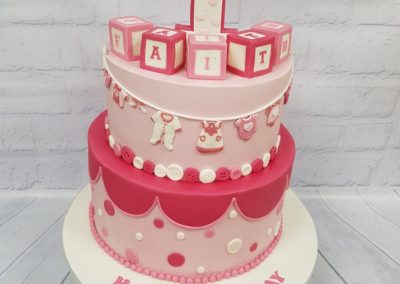 1st Birthday Cake - 2 tier - building blocks top - baby clothes and patterns