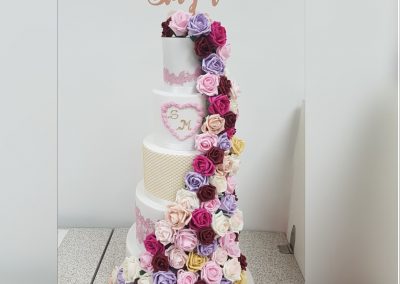 Wedding Cake - 5 Tier - Floral drape top to bottom pink, purple and red roses