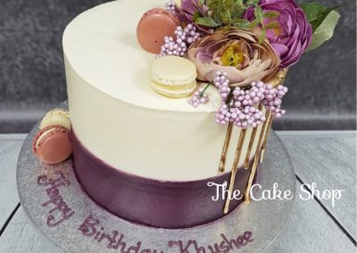 Birthday Cake with - purple base, cream with macaron decoration and organza flowers